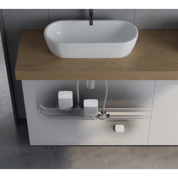 Ajax WaterStop white fitted to hot and cold water pipes in cabinet for basin