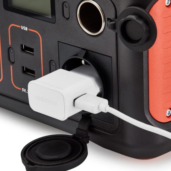 Close up view of cell phone charger plugged into Jackery Explorer 250 Portable Power Station