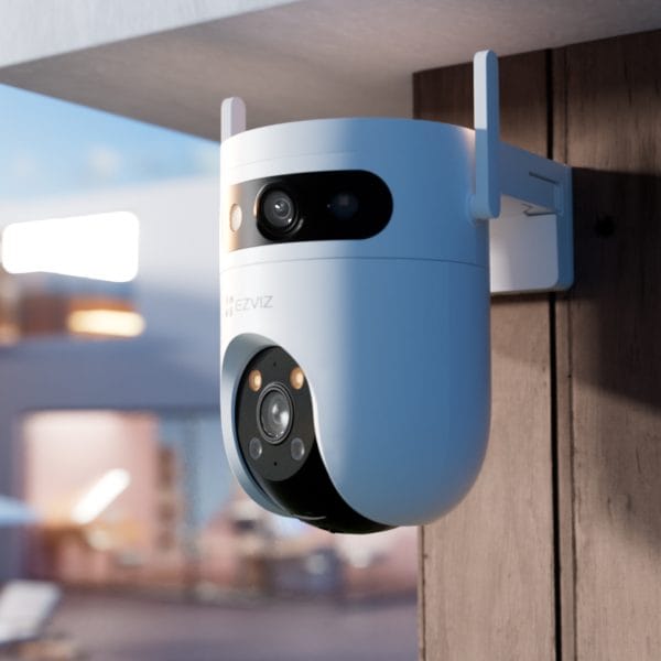 EZVIZ H9c 2K Dual-Lens Pan & Tilt WiFi Camera installed on wooden fence